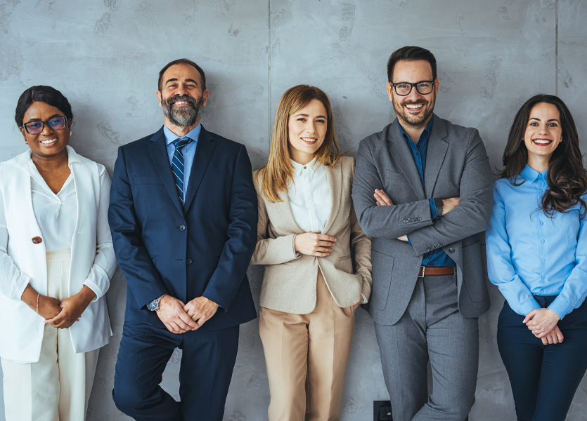 business-people-standing-together-against-wall